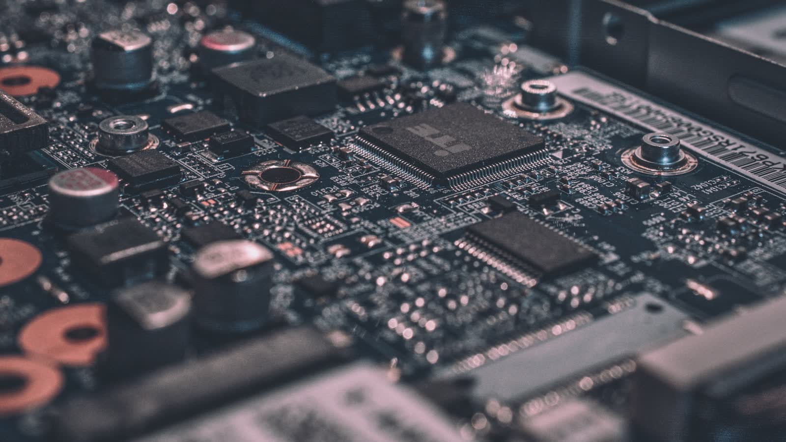 Close-up of a computer motherboard showing chips and circuitry