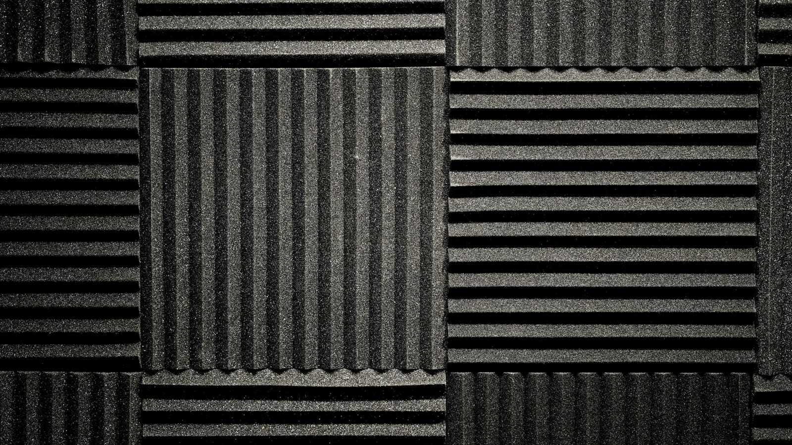 A wall covered in wedge-patterned acoustic foam panels