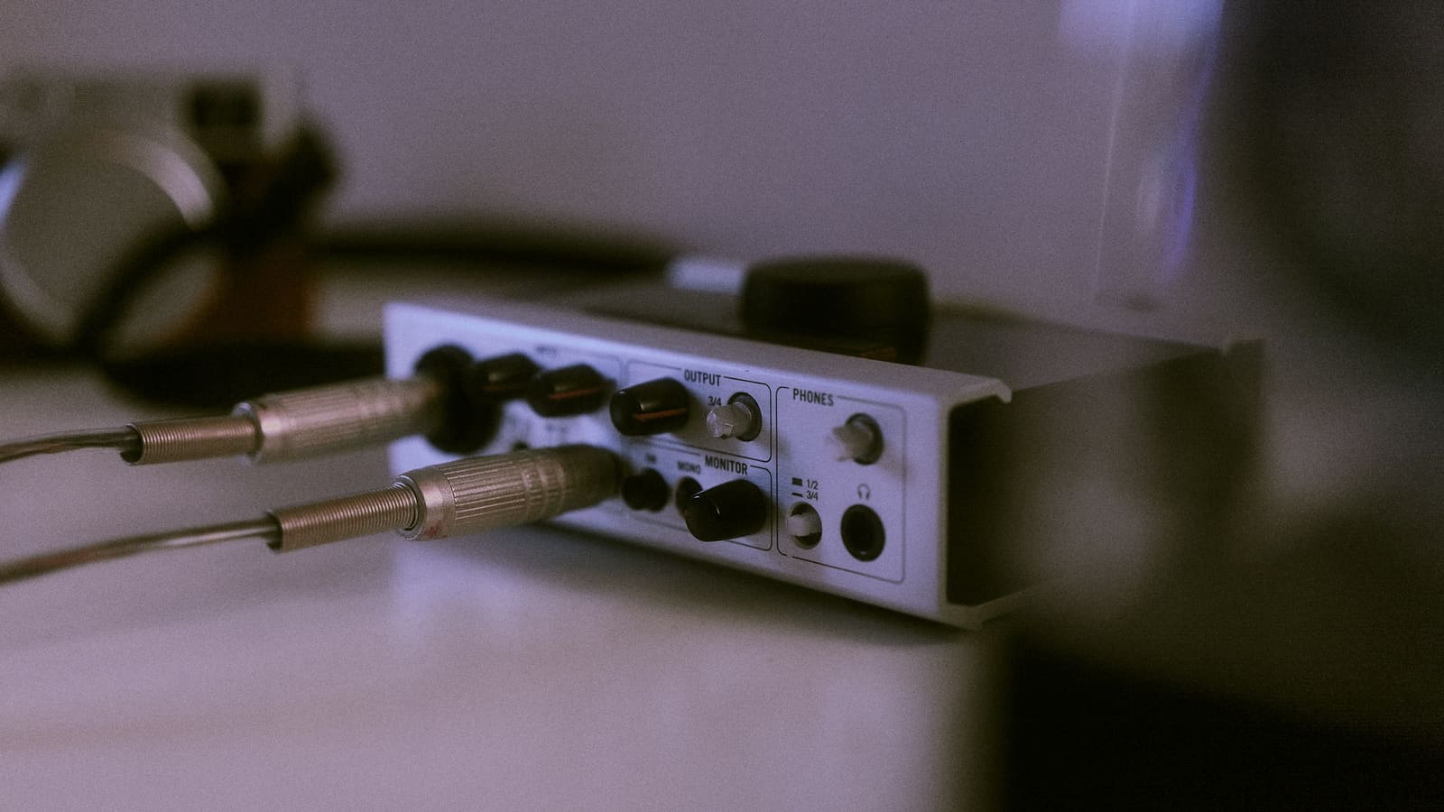 An audio interface with cables connected to its inputs