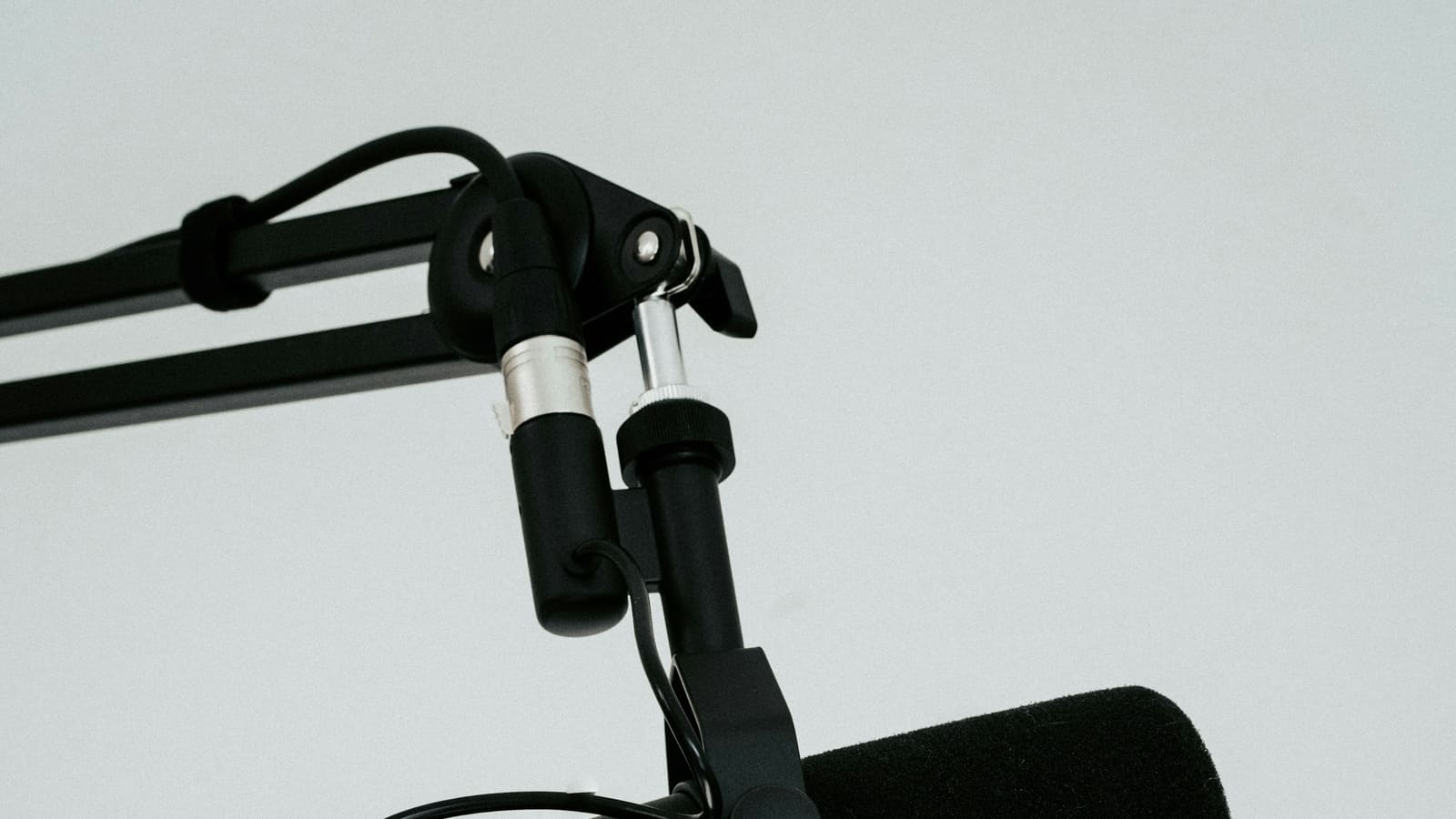 Close-up of the jointed arms of a microphone boom stand
