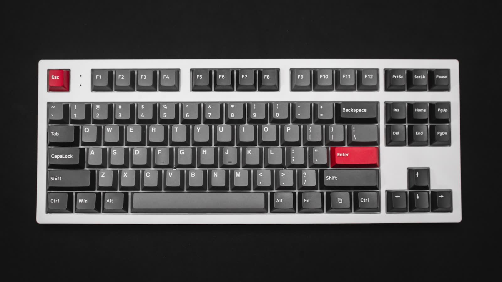 A mechanical keyboard photographed on a black surface