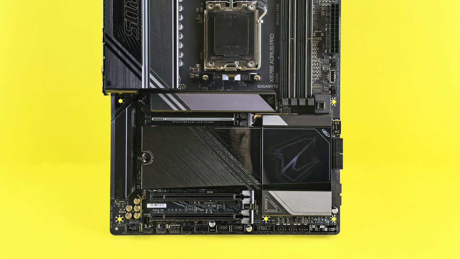 A motherboard photographed from above against a flat coloured background