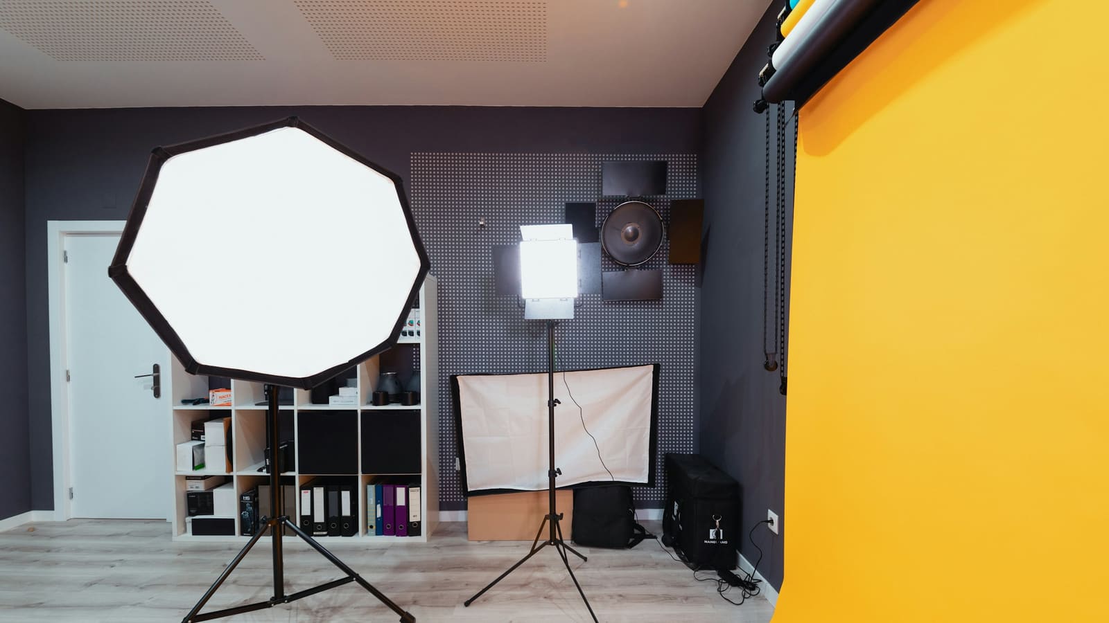 A softbox light on a stand in a small studio