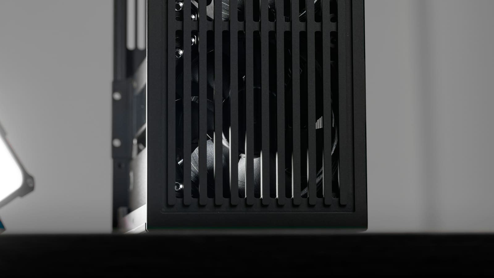 A black computer case with a vented front panel