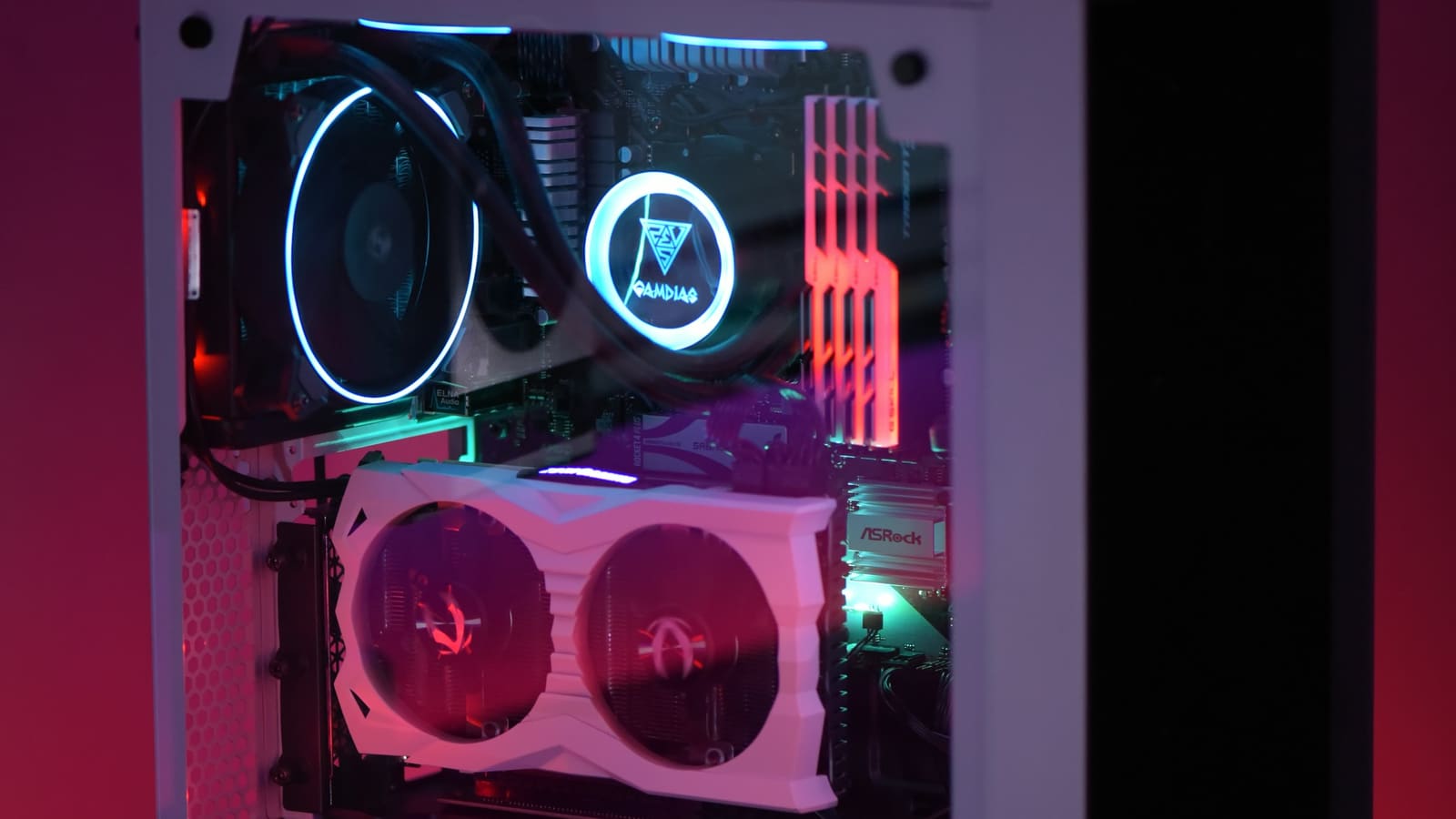 The lit interior of a finished computer build seen through glass