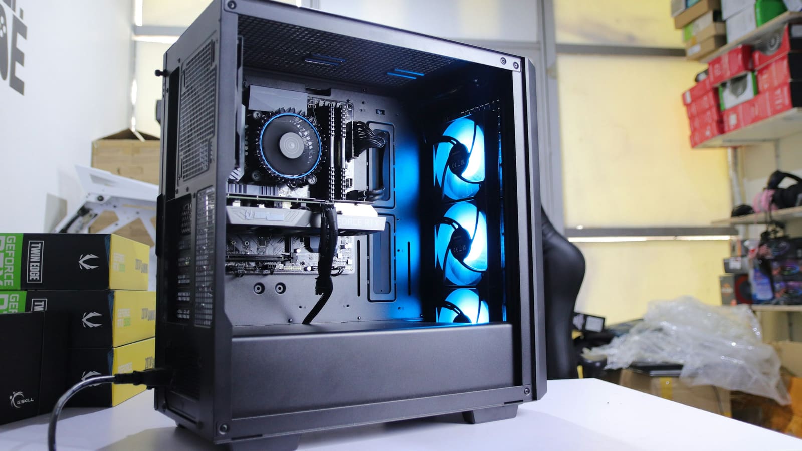 A computer tower with a case fan visible behind the panel