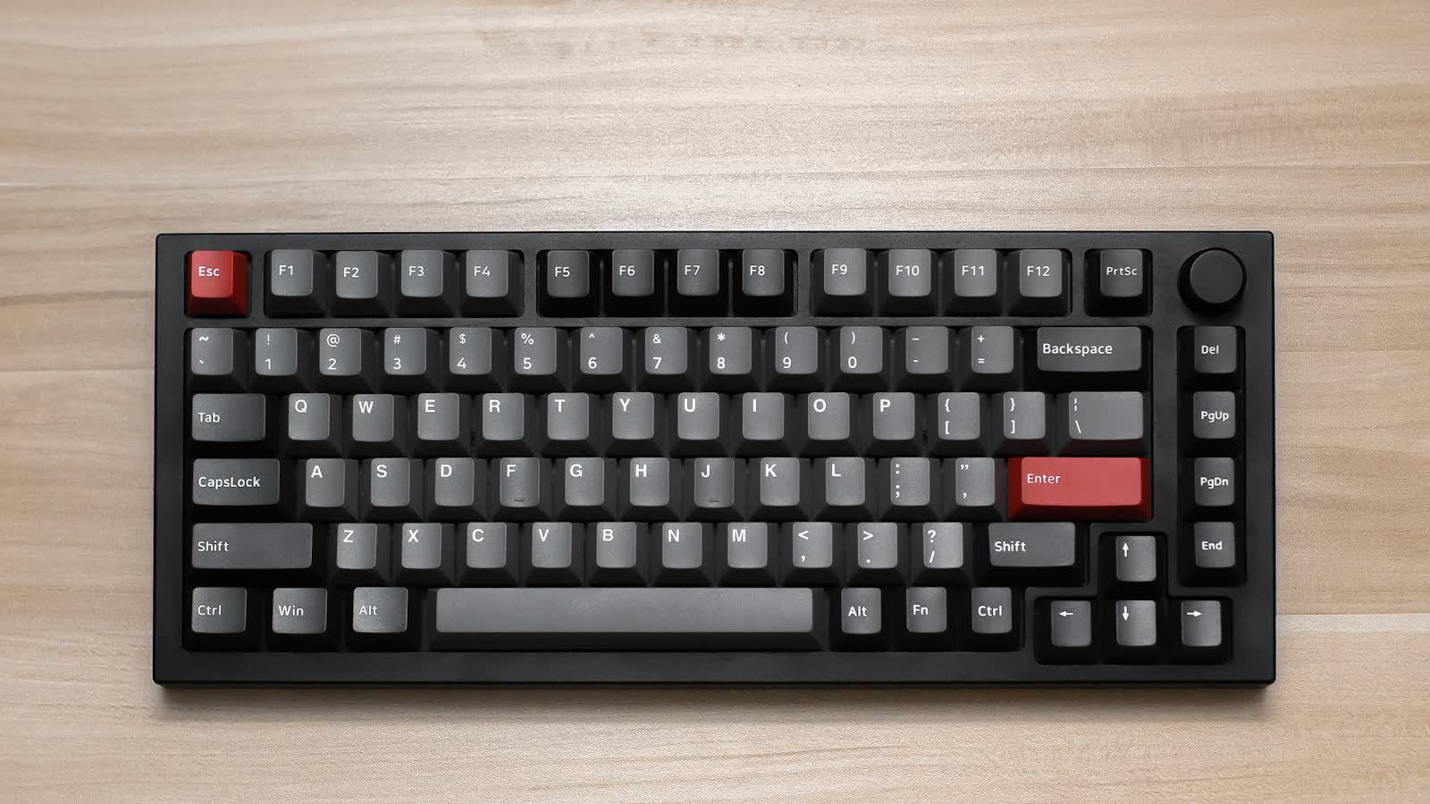 A mechanical keyboard on a wooden desk