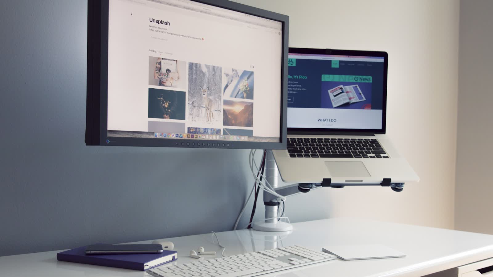A monitor and a second screen set back at reading distance on a desk