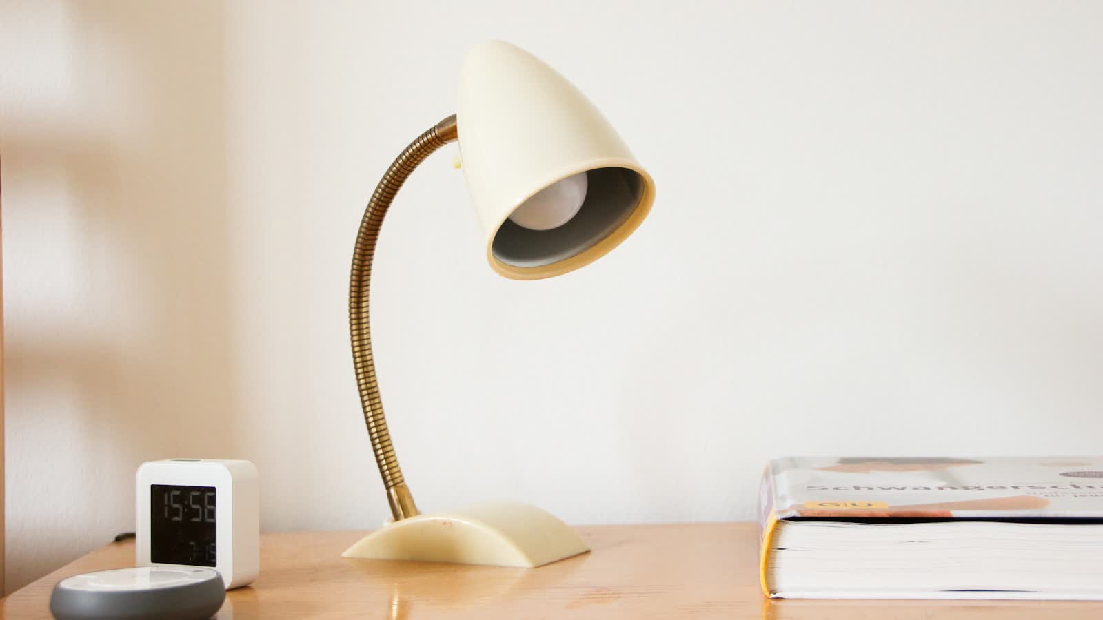 A small warm table lamp on a shelf