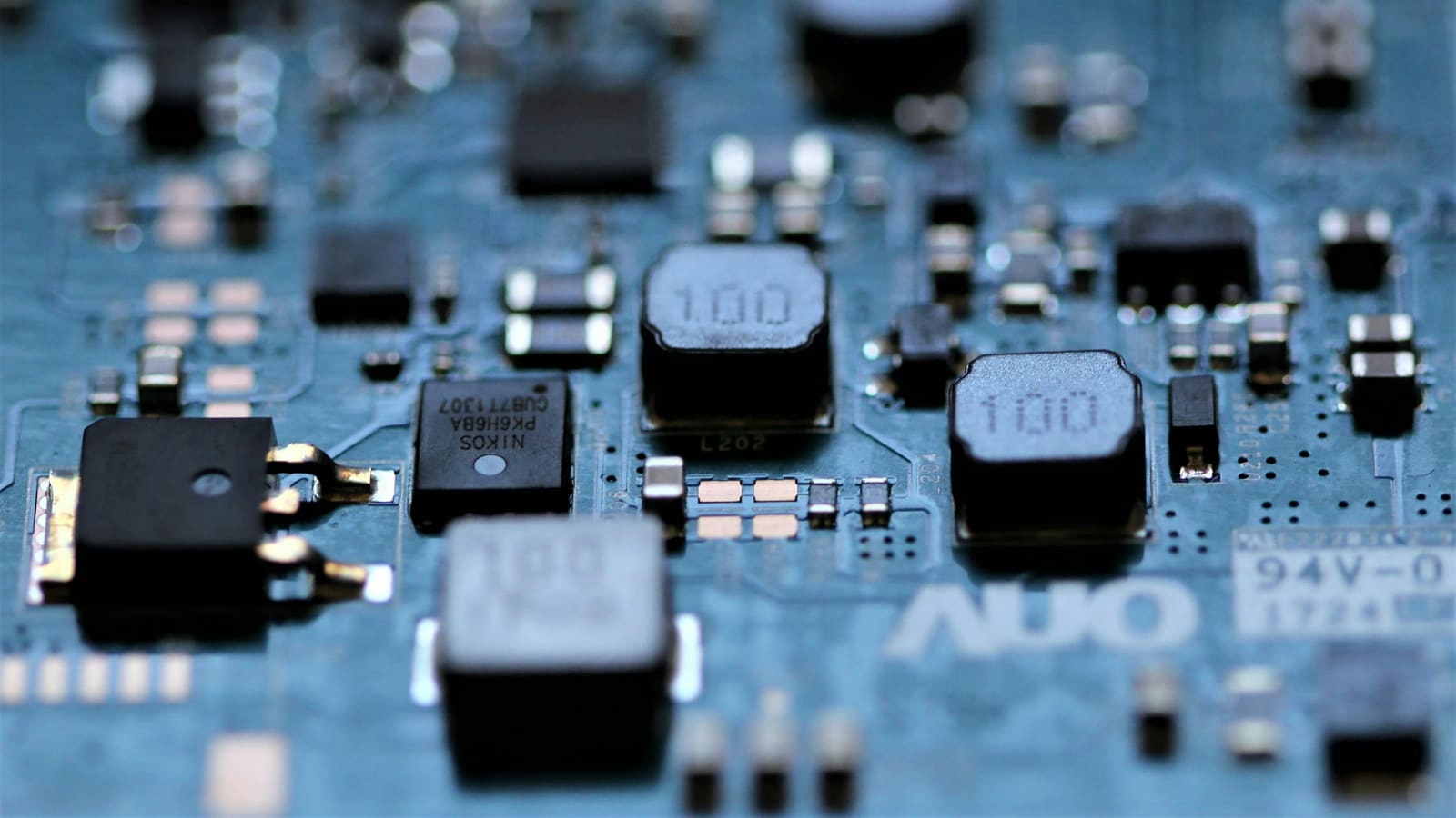 Macro photograph of a circuit board covered in small components