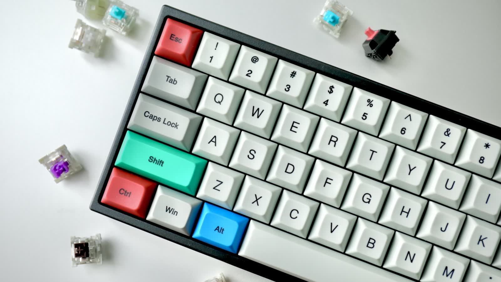 A mechanical keyboard with several keycaps removed, exposing the switches